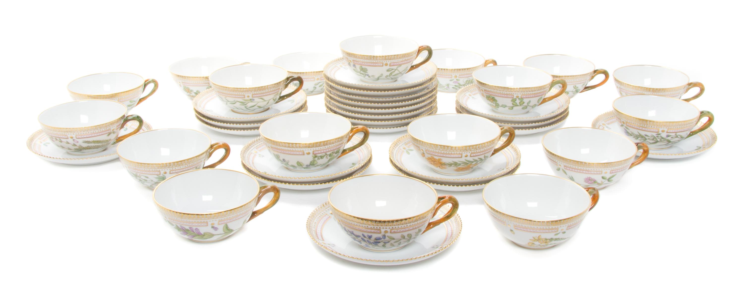 Eighteen Royal Copenhagen Flora Danica Teacups and Saucers Diameter 6 inches.