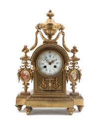 A French Gilt Bronze and Porcelain Inset Mantel Clock, Height 15 1/2 inches.