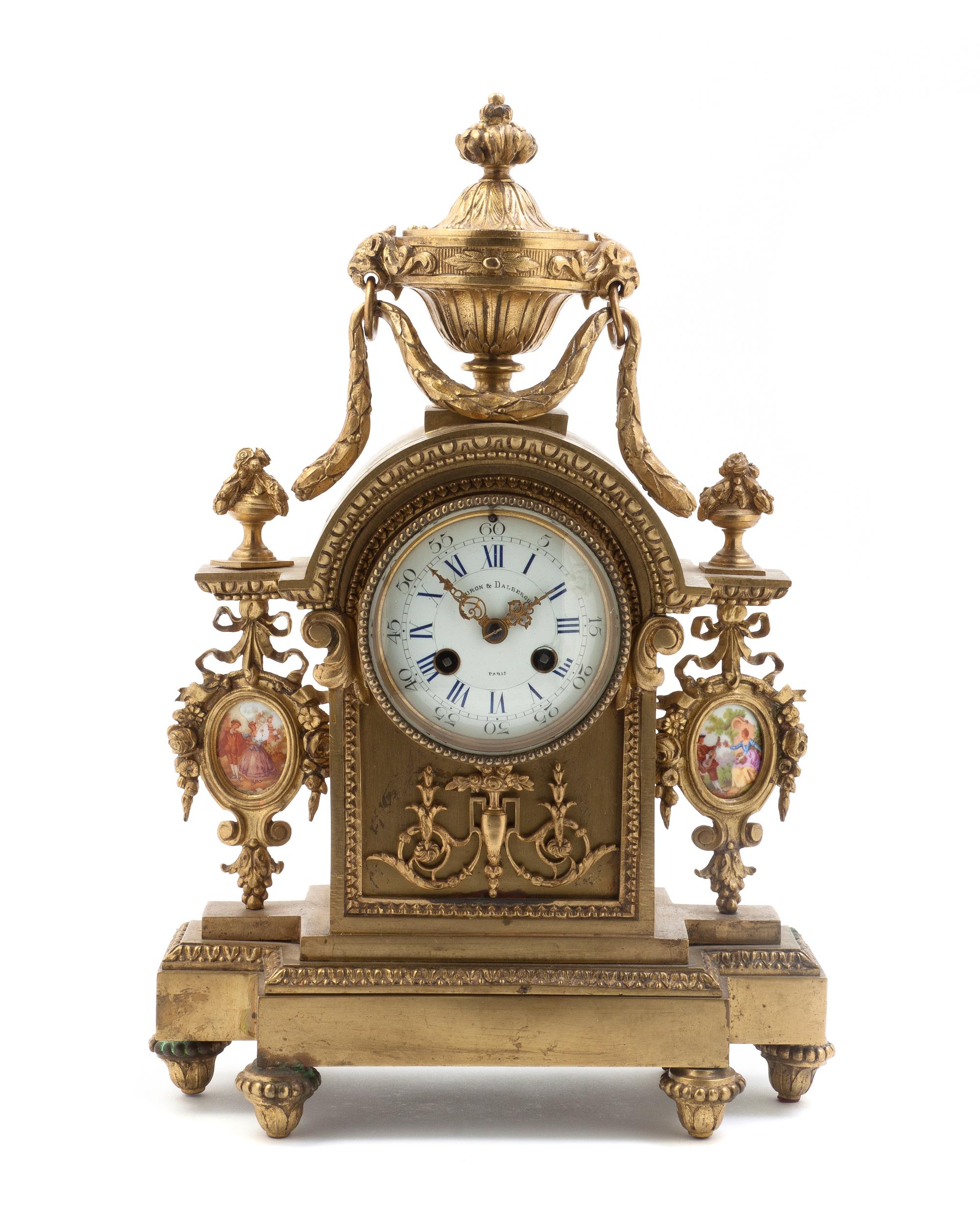A French Gilt Bronze and Porcelain Inset Mantel Clock, Height 15 1/2 inches.