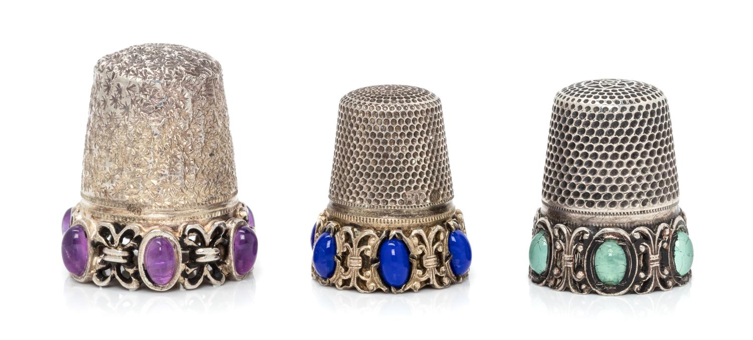 Three Silver and Hardstone Thimbles, , comprising an example with a knurled top and body above an openwork base inset with six lapis la