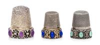Three Silver and Hardstone Thimbles, , comprising an example with a knurled top and body above an openwork base inset with six lapis la