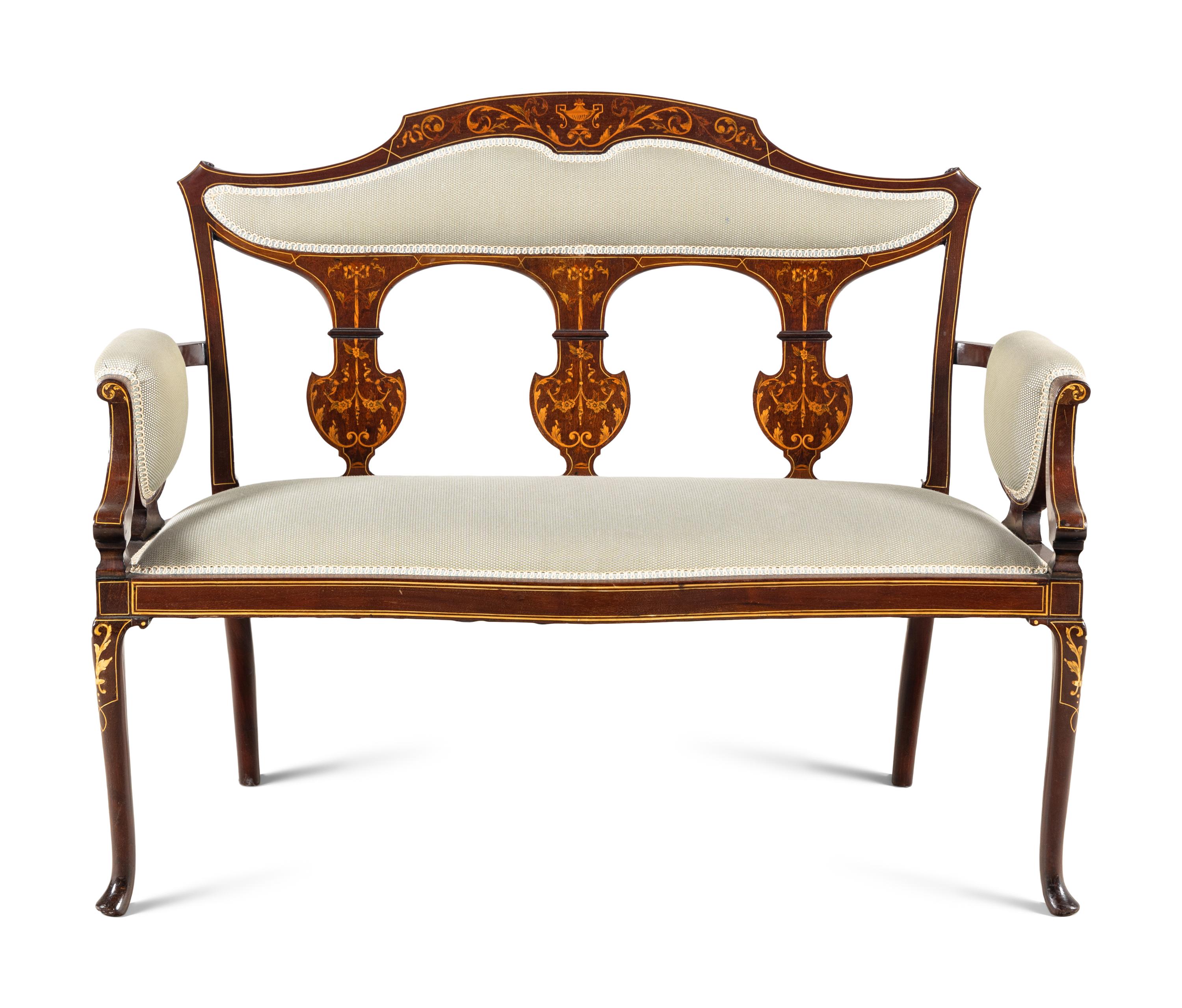An Edwardian Mahogany and Marquetry Settee