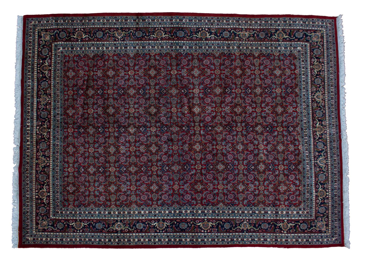 A Tabriz Wool Rug 12 feet 10 inches x 10 feet.