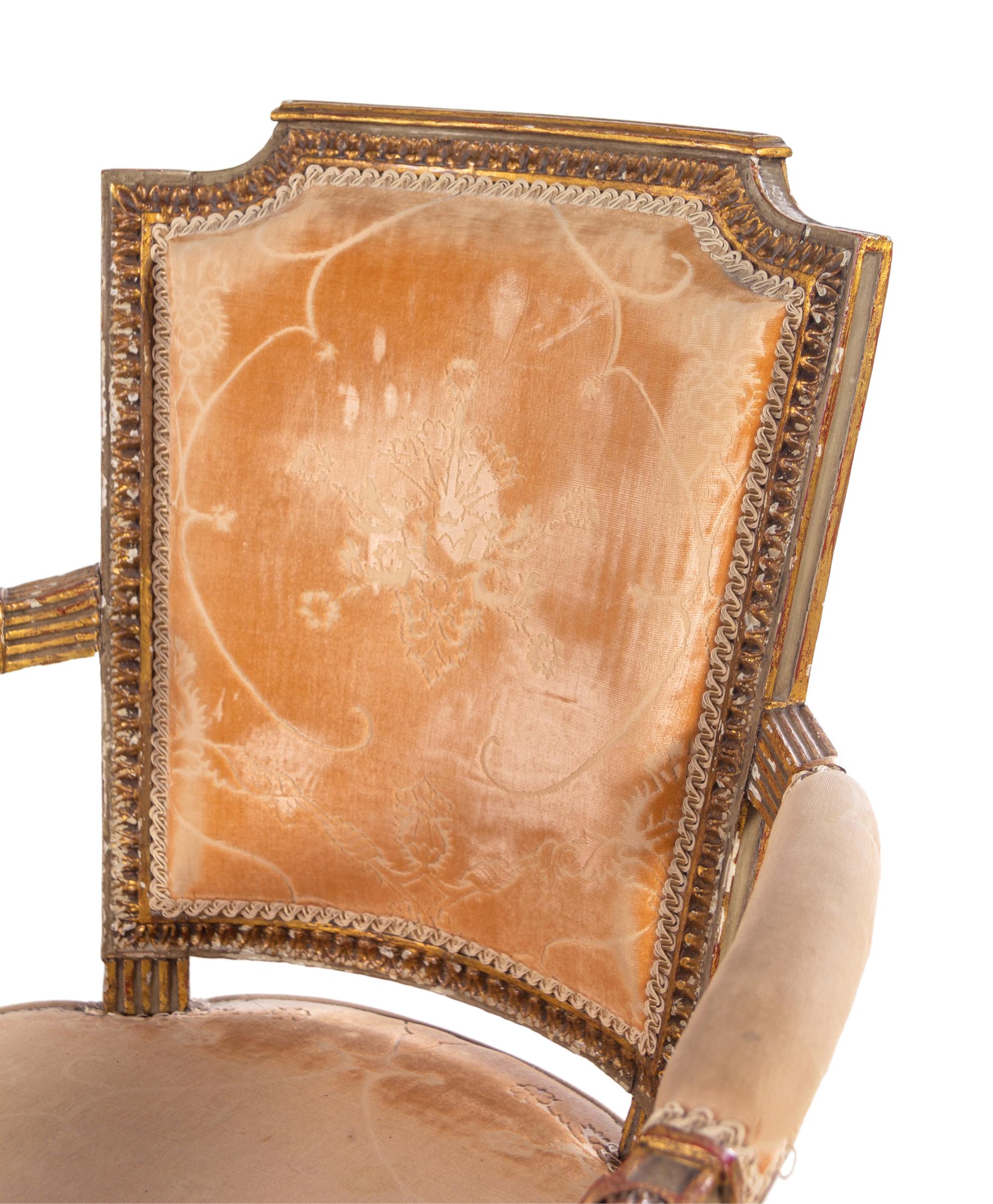 A Pair of Directoire Painted and Parcel Gilt Fauteuils and a Directoire Painted and Parcel Gilt Bergère