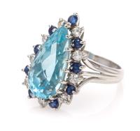 A 14 Karat White Gold, Aquamarine, Diamond and Sapphire Ring, 4.00 dwts.