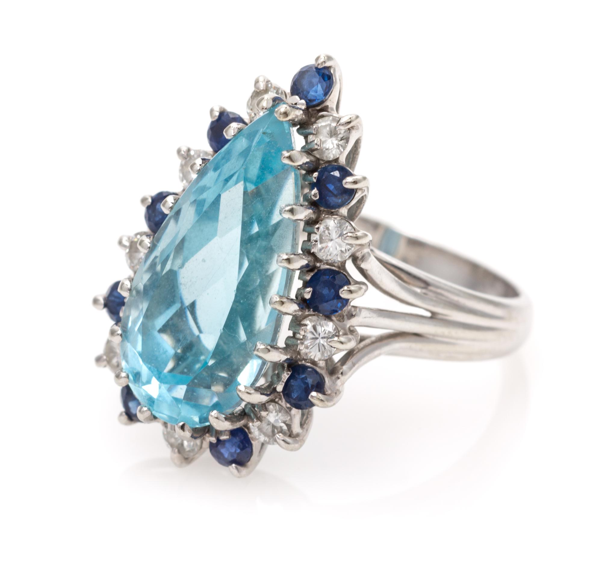 A 14 Karat White Gold, Aquamarine, Diamond and Sapphire Ring, 4.00 dwts.