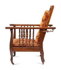 A Victorian Carved Mahogany and Tufted Velvet Upholstered Child's Reclining Armchair