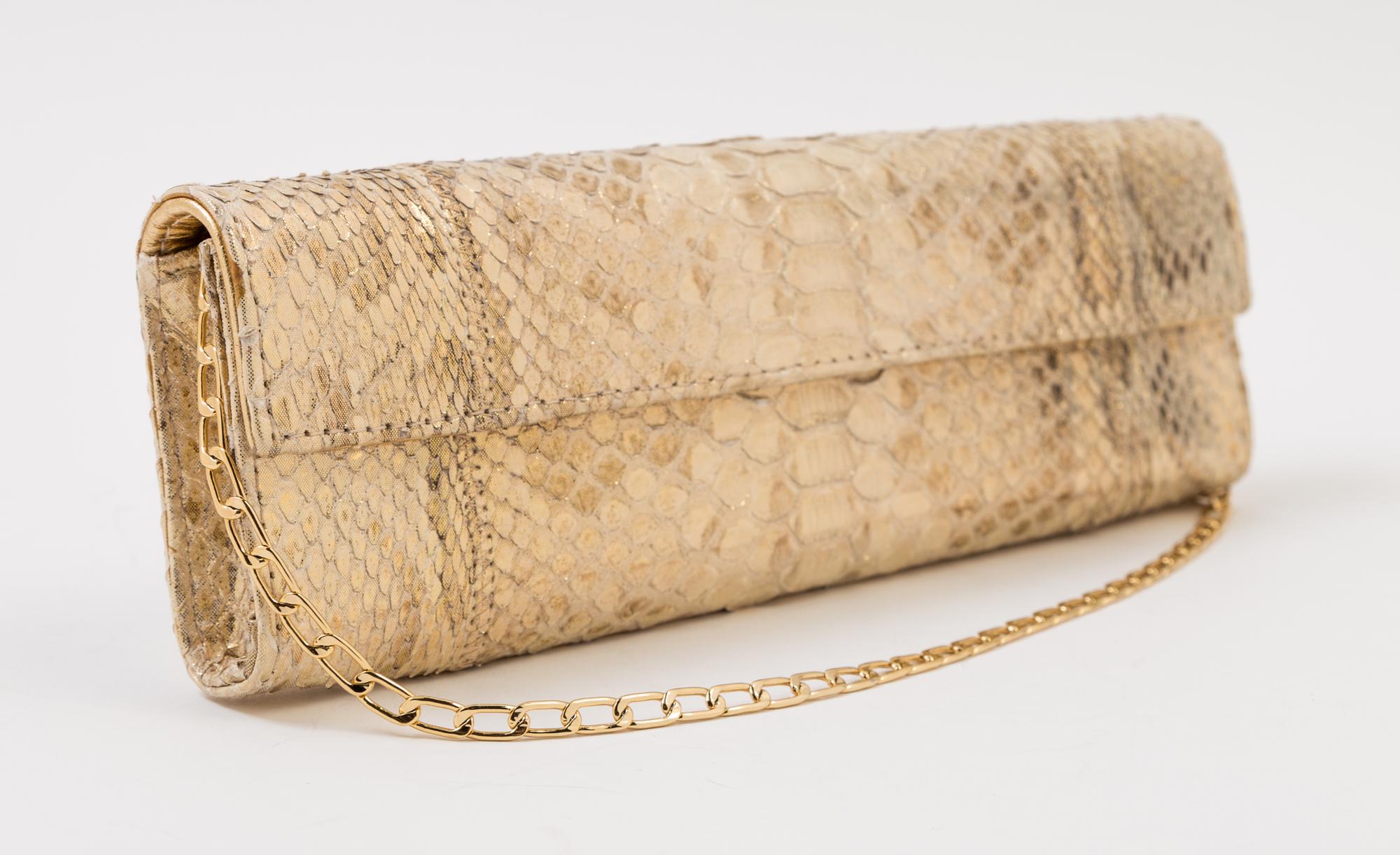 A Carlos Falchi Gold Snakeskin Clutch, 10" x 3.5" x 1".