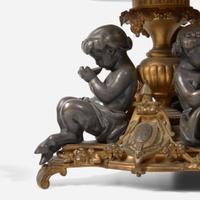 A pair of French Napoleon III patinated and gilt bronze tazza with fauns Bearing marks for Henri Picard (French, active 1831-1864), late 19th century