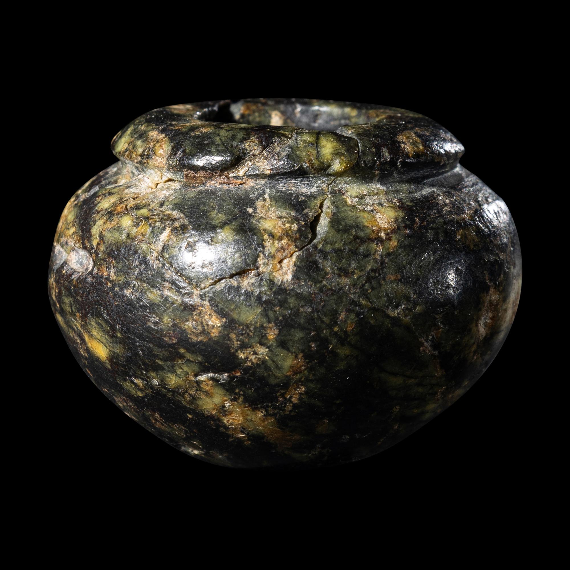 An Egyptian Serpentine Cosmetic Vessel