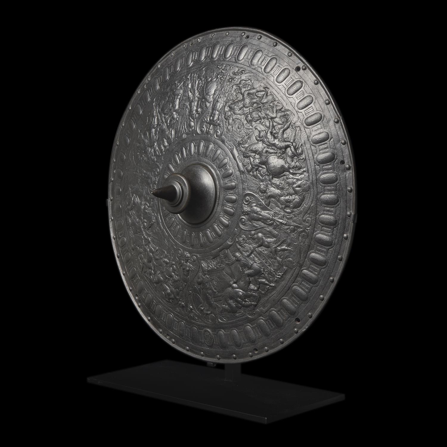 A Victorian Iron Parade Shield with Scenes from the Life of Julius Caesar
