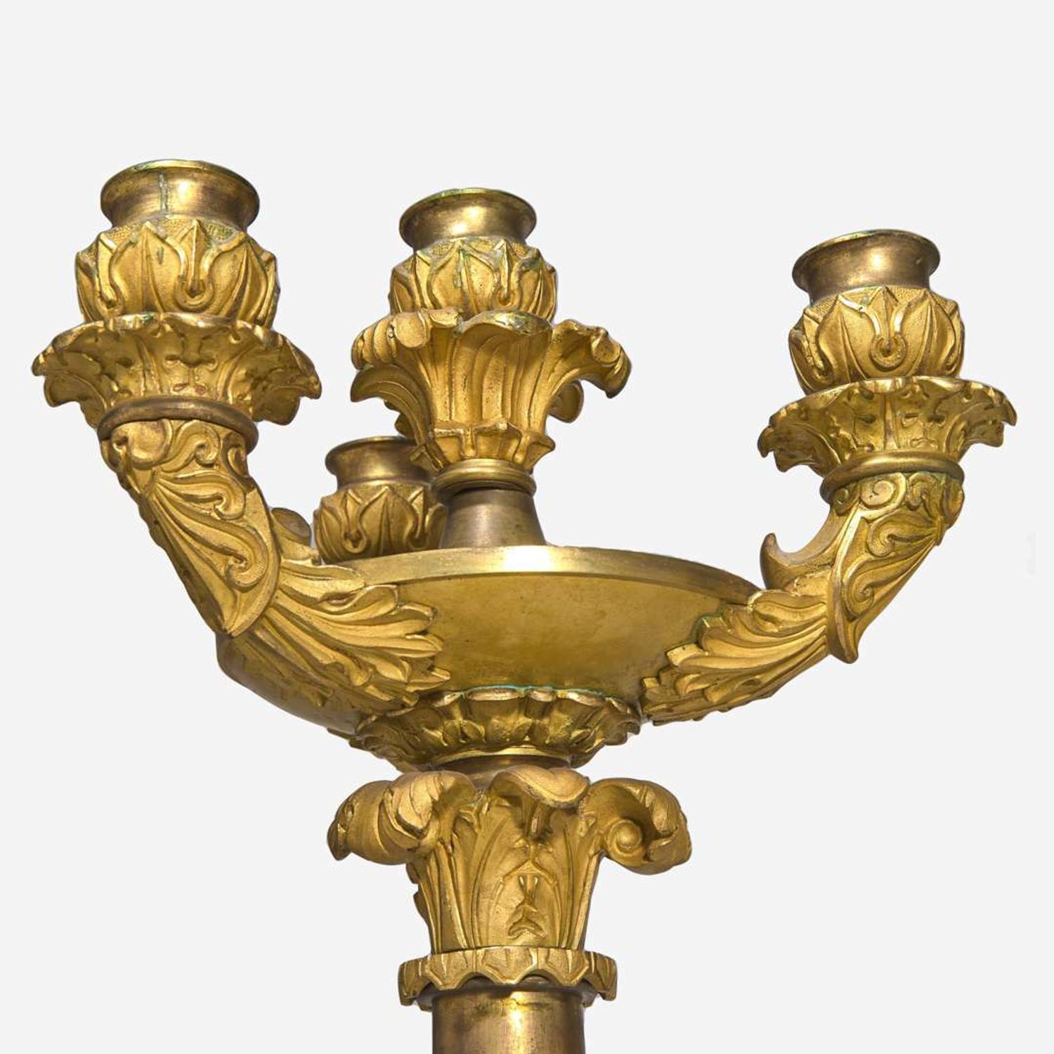 A pair of large French Louis Philippe ormolu candlesticks circa 1830-1840