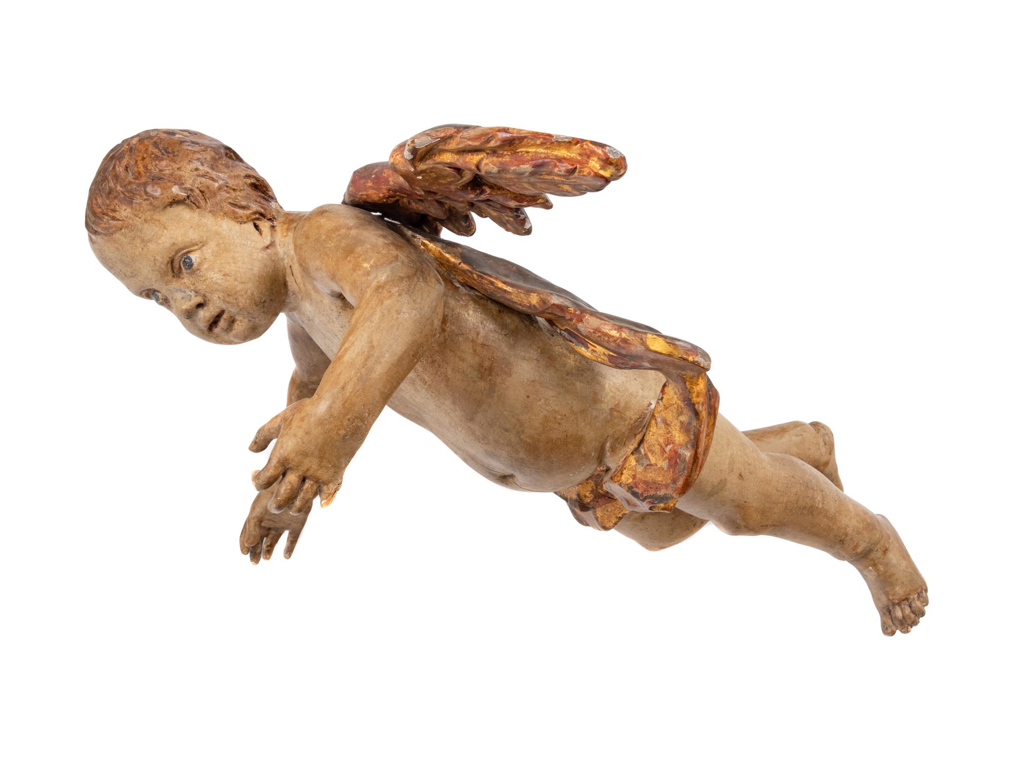 An Italian Painted and Parcel Gilt Figure of a Cherub