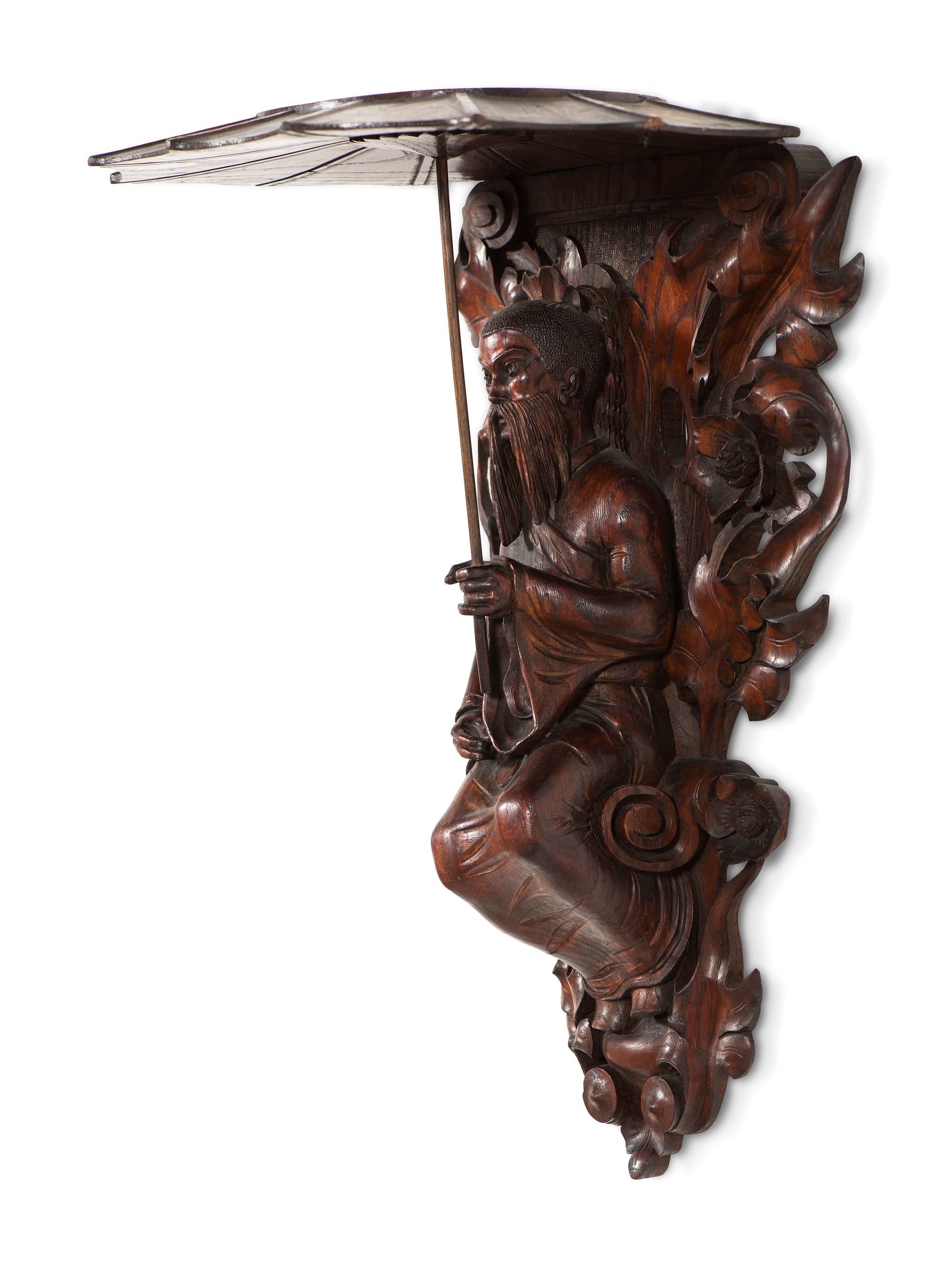 A Pair of Carved Oak Figural Wall Brackets