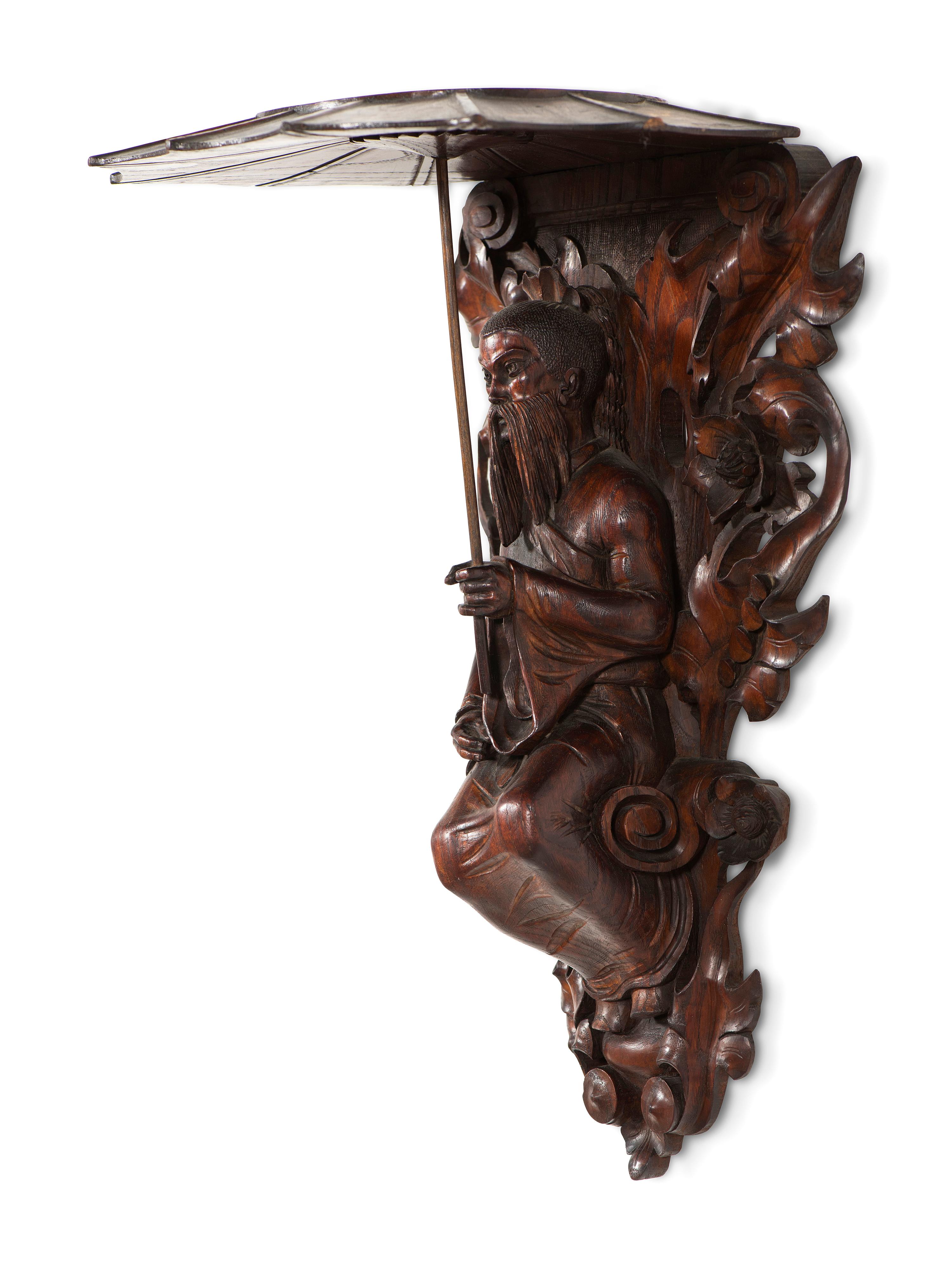 A Pair of Carved Oak Figural Wall Brackets