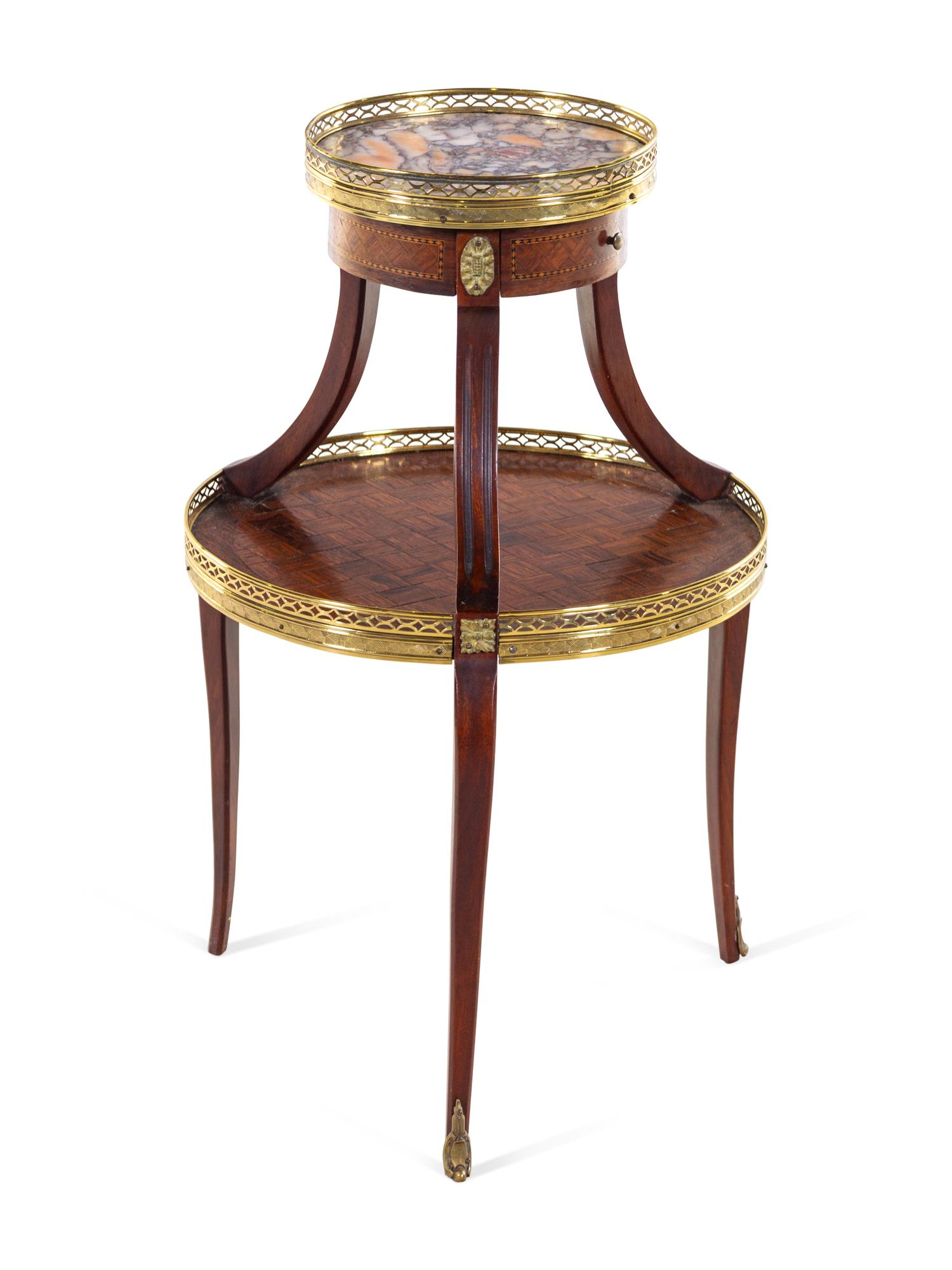 A Louis XV/XVI Two Tiered Mahogany Table