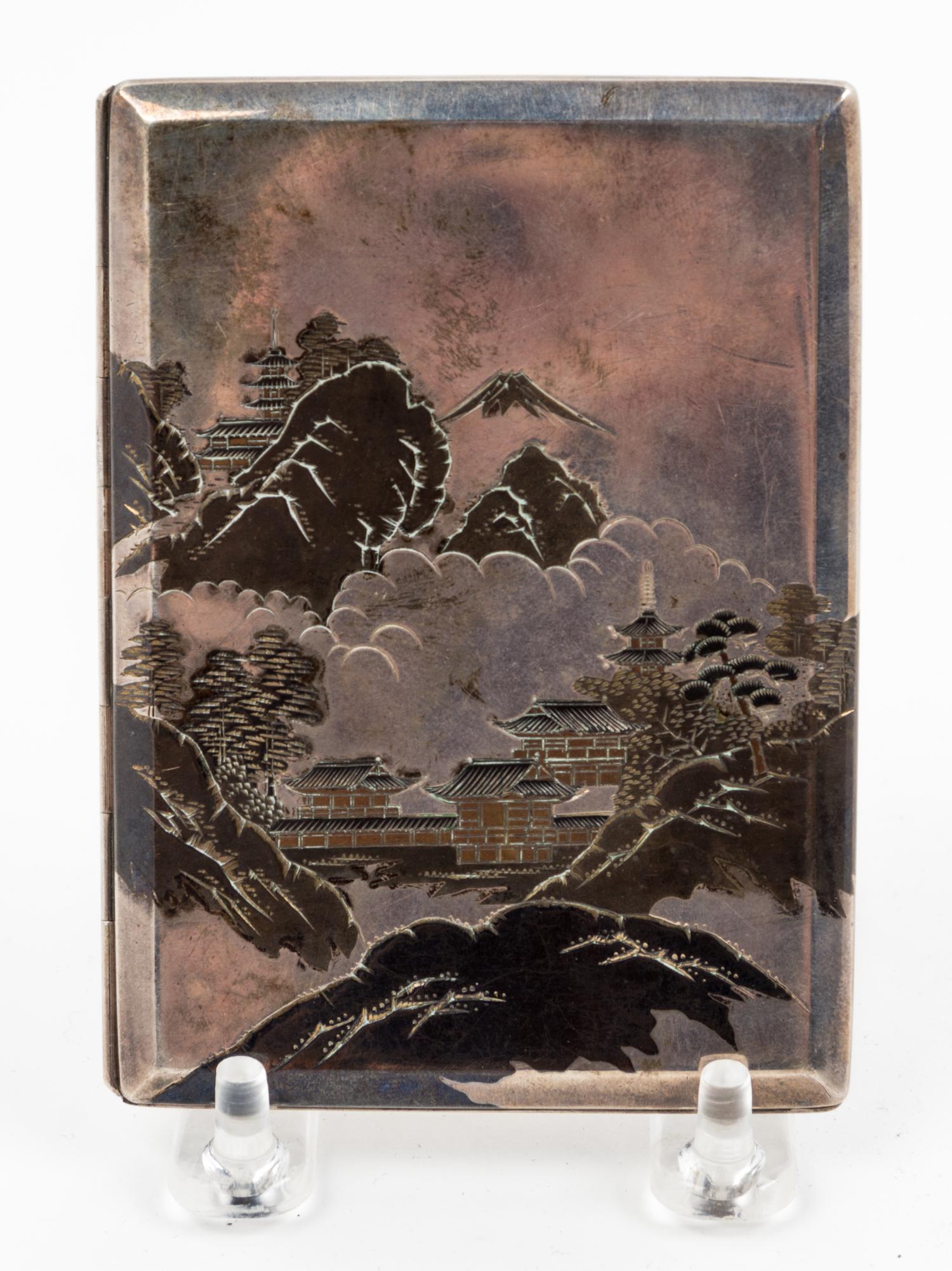 A Japanese Silver Cigarette Case Height 4 1/2 inches.