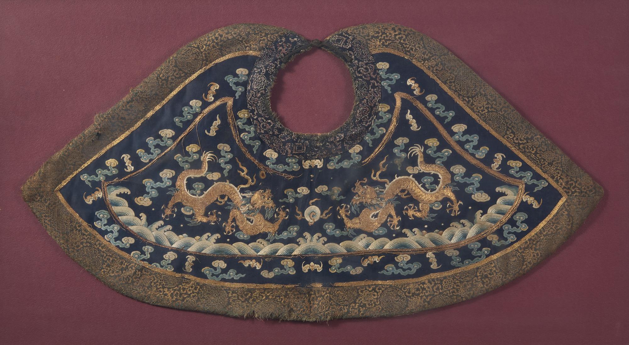 A Chinese 'Dragon' Court Collar, Qing Dynasty 清 石青地綉雙龍戲珠朝服領