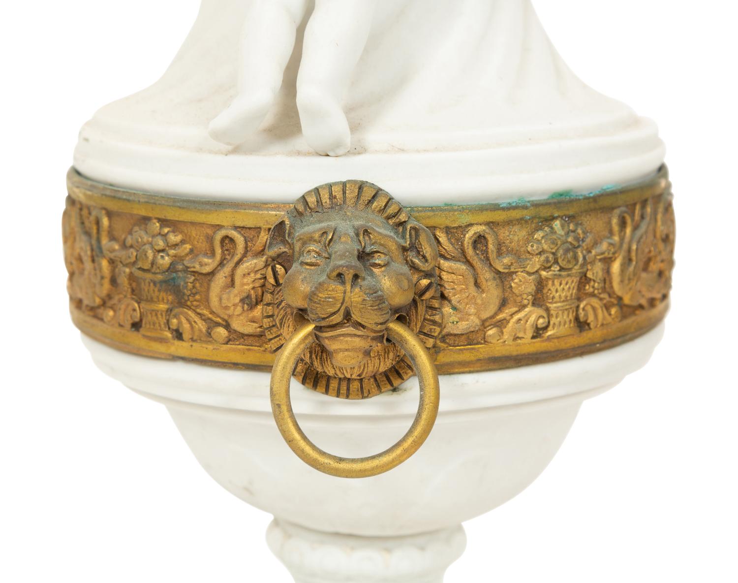 A Pair of Gilt Metal Mounted Bisque Porcelain Urns