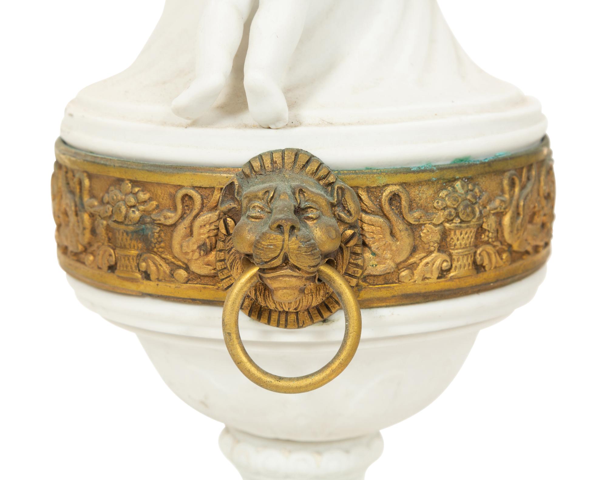 A Pair of Gilt Metal Mounted Bisque Porcelain Urns