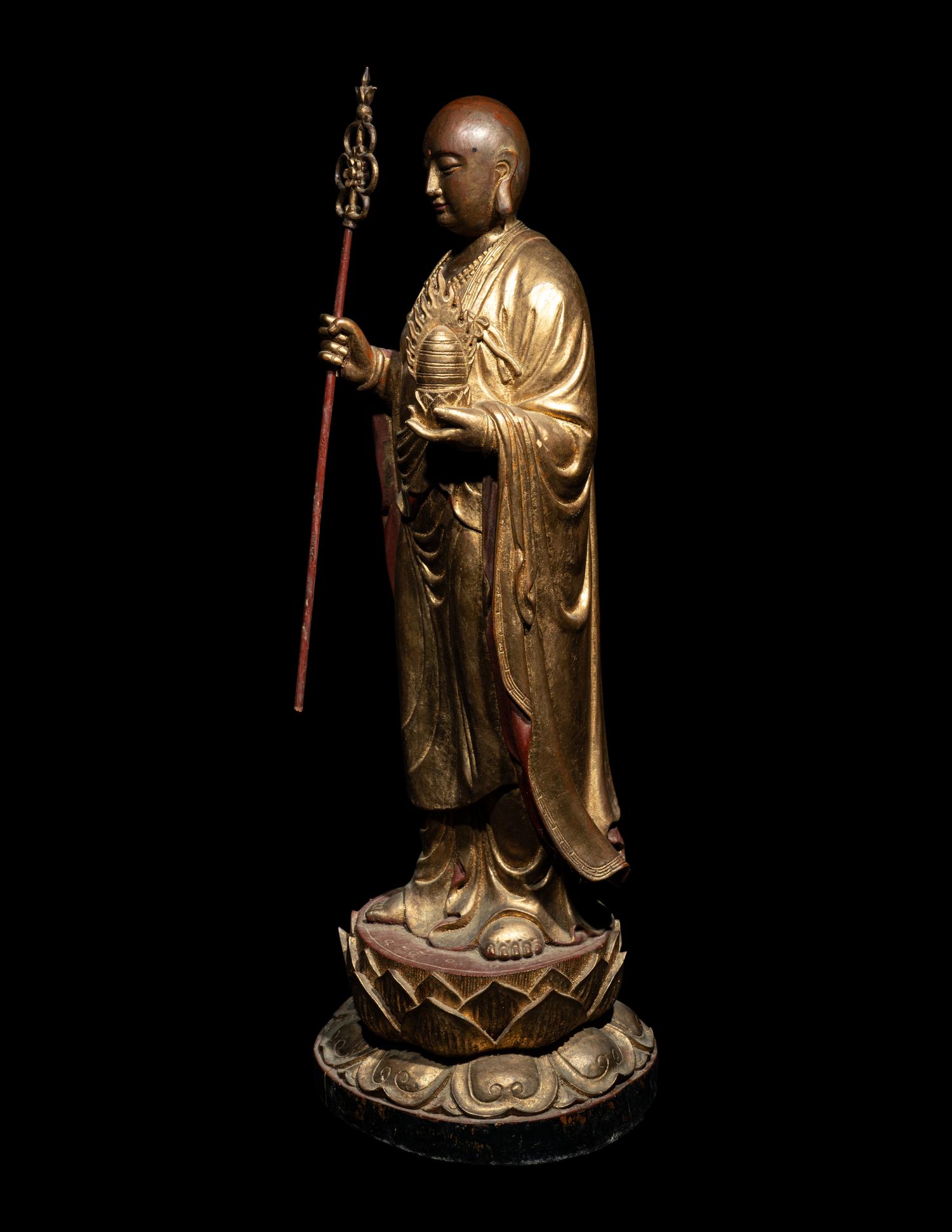 A Chinese Gilt and Lacquered Wood Figure of a Standing Monk