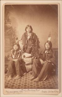 CHOATE, John N. (1848-1902), photographer. Boudoir card featuring a trio of Santee Sioux students of Carlisle Indian School, identified on mount as Henry Standing Bear, Wounded Yellow Robe, and Timber Yellow Robe. Carlisle, PA, ca 1883.