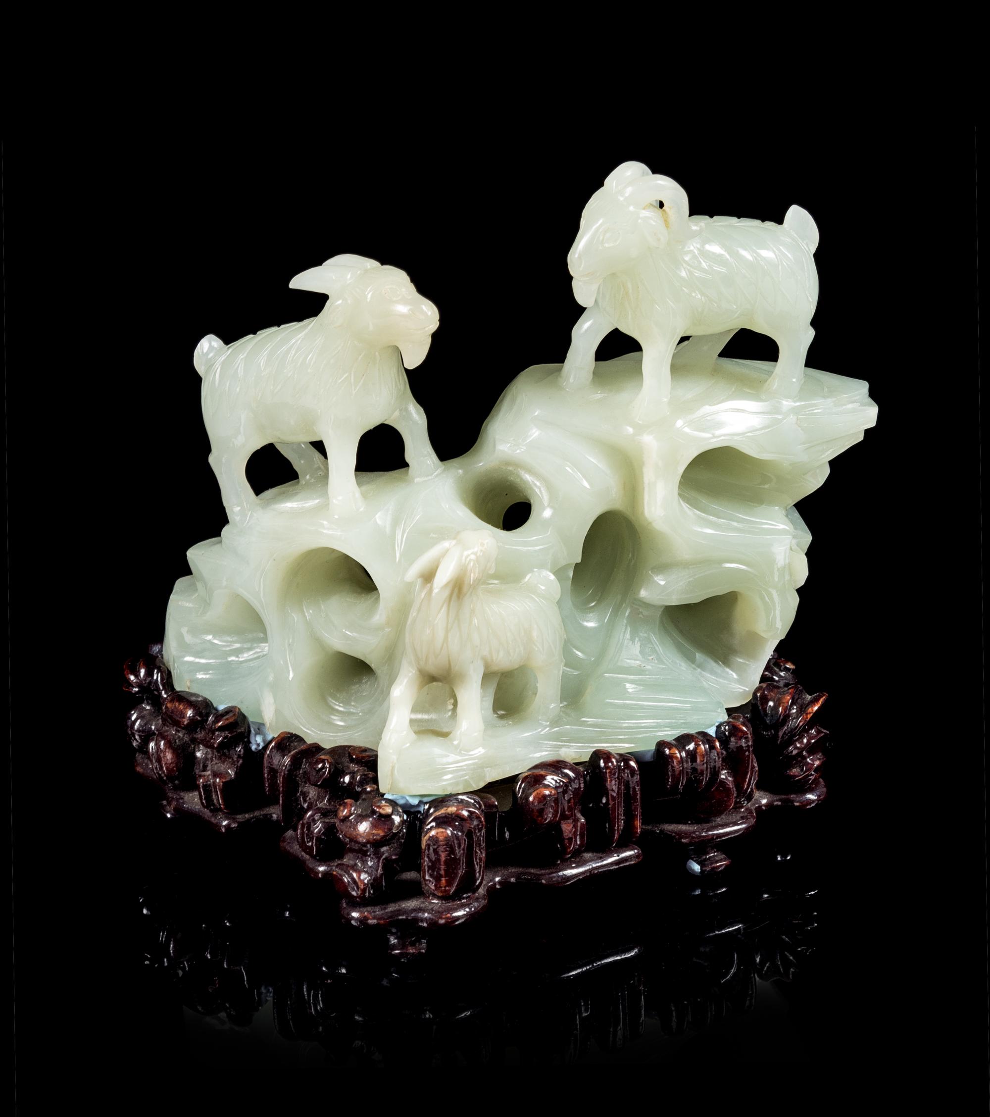 A Pale-Celadon Jade Carving of Three Rams Height 4 1/8 inches. — 19TH/20TH CENTURY
