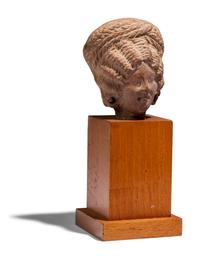 An Egyptian Terracotta Head of a Woman