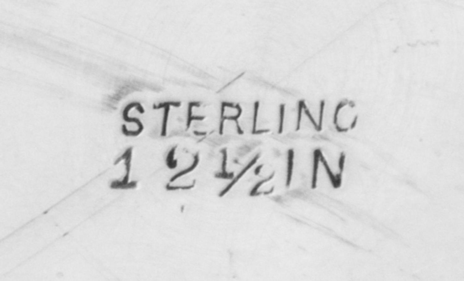 An American Silver Tray, Graff, Washbourne & Dunn, New York, NY, having a foliate swag decorated rim surrounding a pierced floral and f