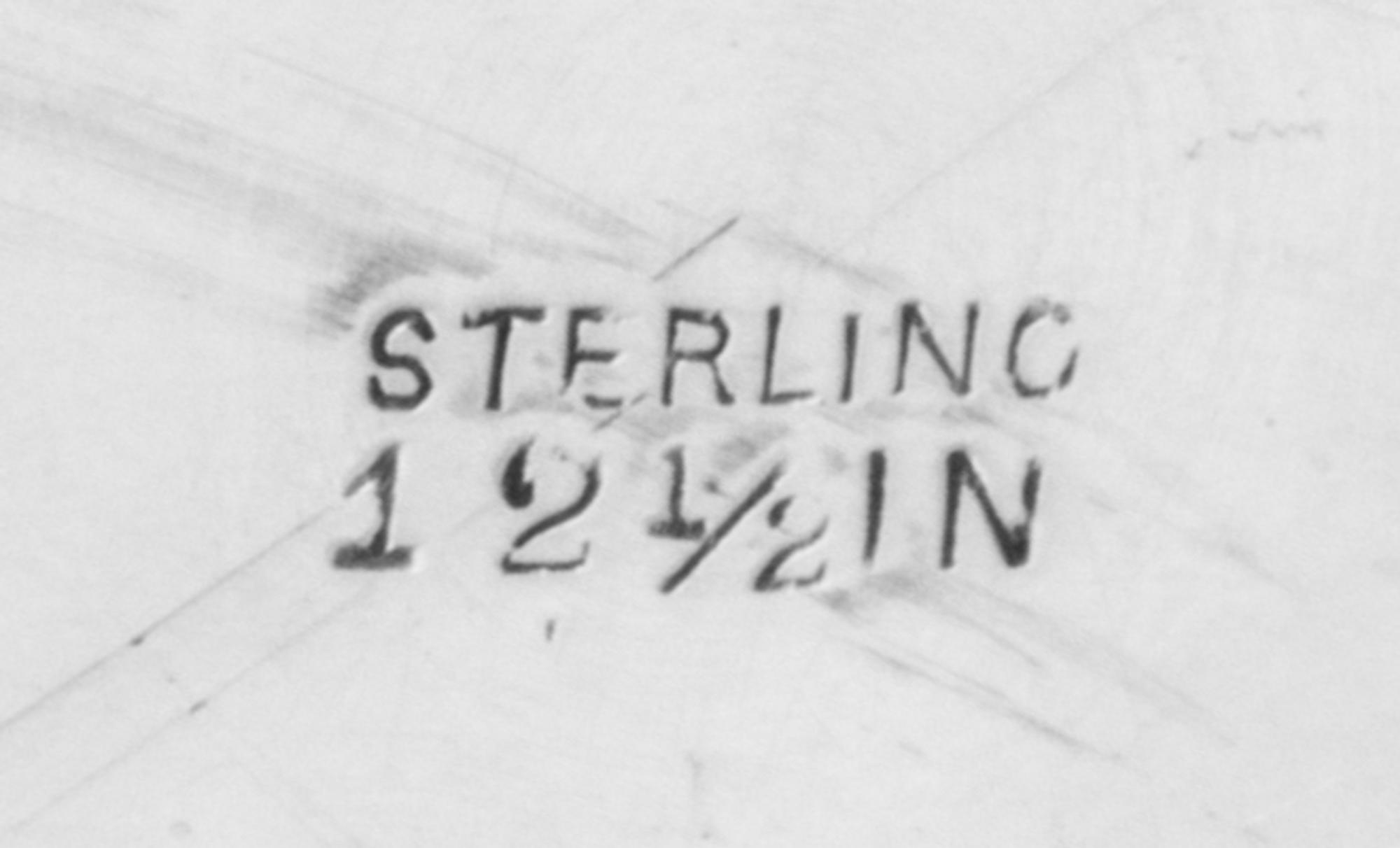 An American Silver Tray, Graff, Washbourne & Dunn, New York, NY, having a foliate swag decorated rim surrounding a pierced floral and f