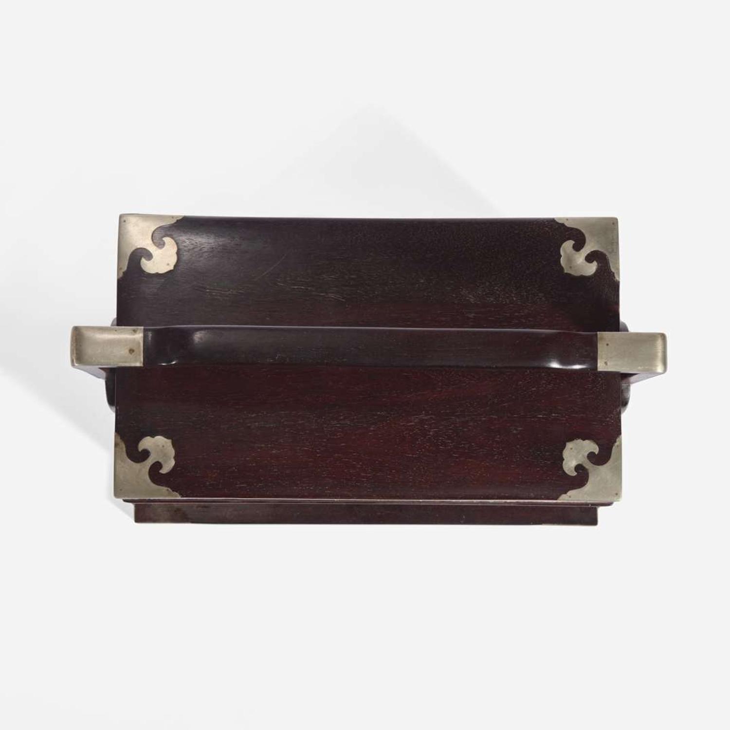 A Chinese stacking hardwood two-tier box, possibly zitan 双层提梁木盒 或紫檀