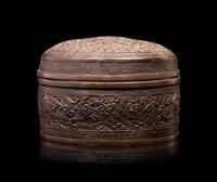 A Bronze Circular Box and Cover