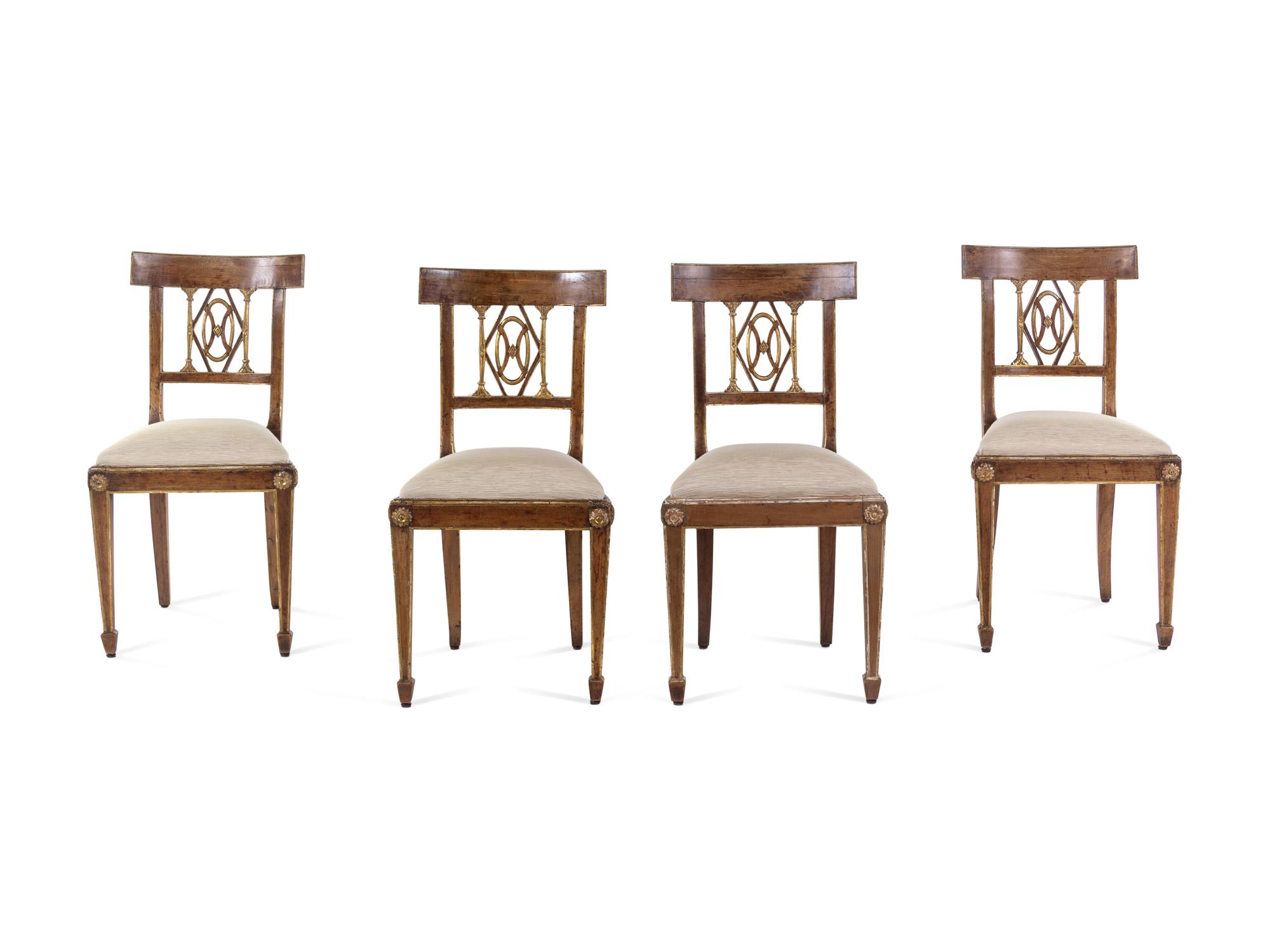 A Set of Four Regency Parcel Gilt Walnut Side Chairs