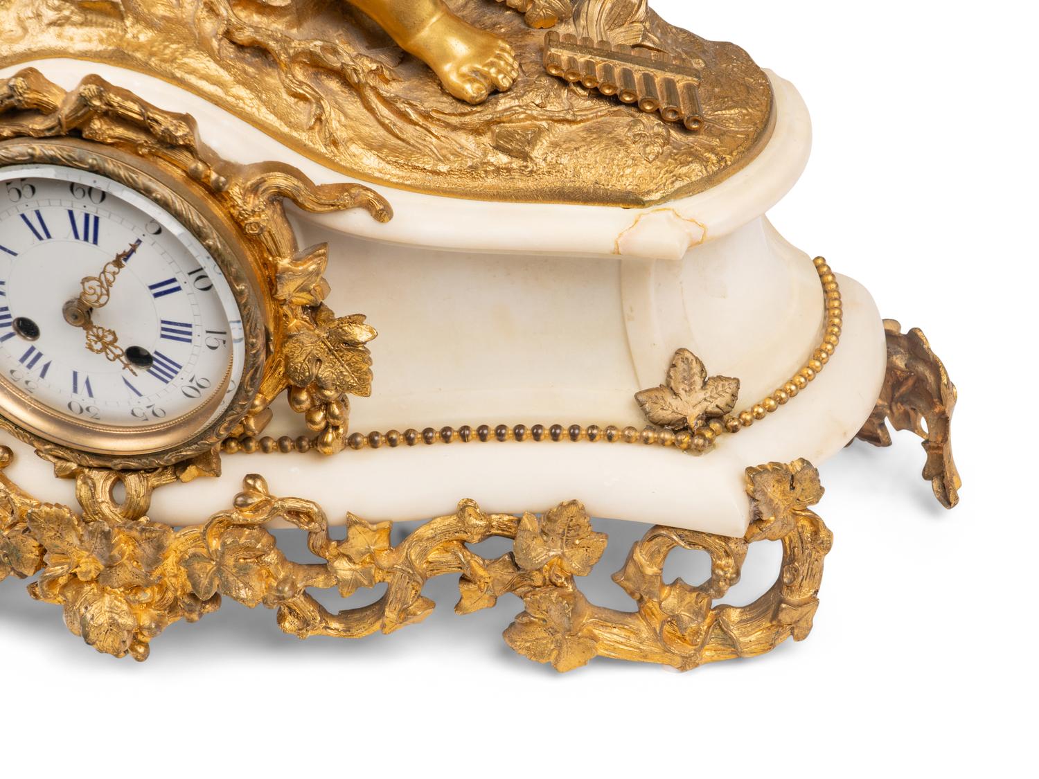 An Assembled French Gilt Bronze Mounted Marble Three-Piece Clock Garniture
