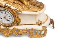 An Assembled French Gilt Bronze Mounted Marble Three-Piece Clock Garniture