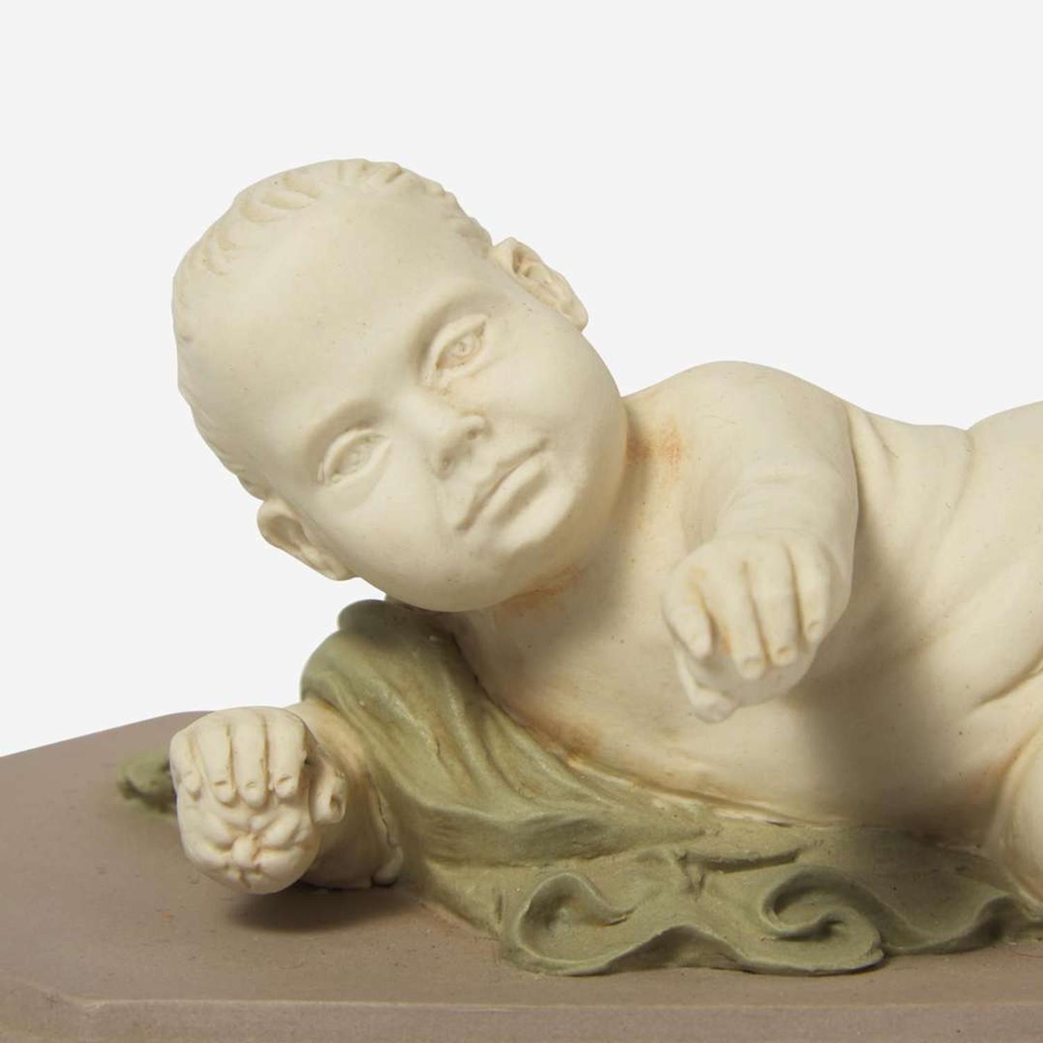 A Wedgwood Tricolor Jasperware Figure of a Reclining Infant UK, circa 1800