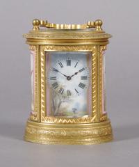 A French Gilt Bronze and Porcelain Mounted Carriage Clock, retailed by Tiffany & Co., Height over handle 4 inches.