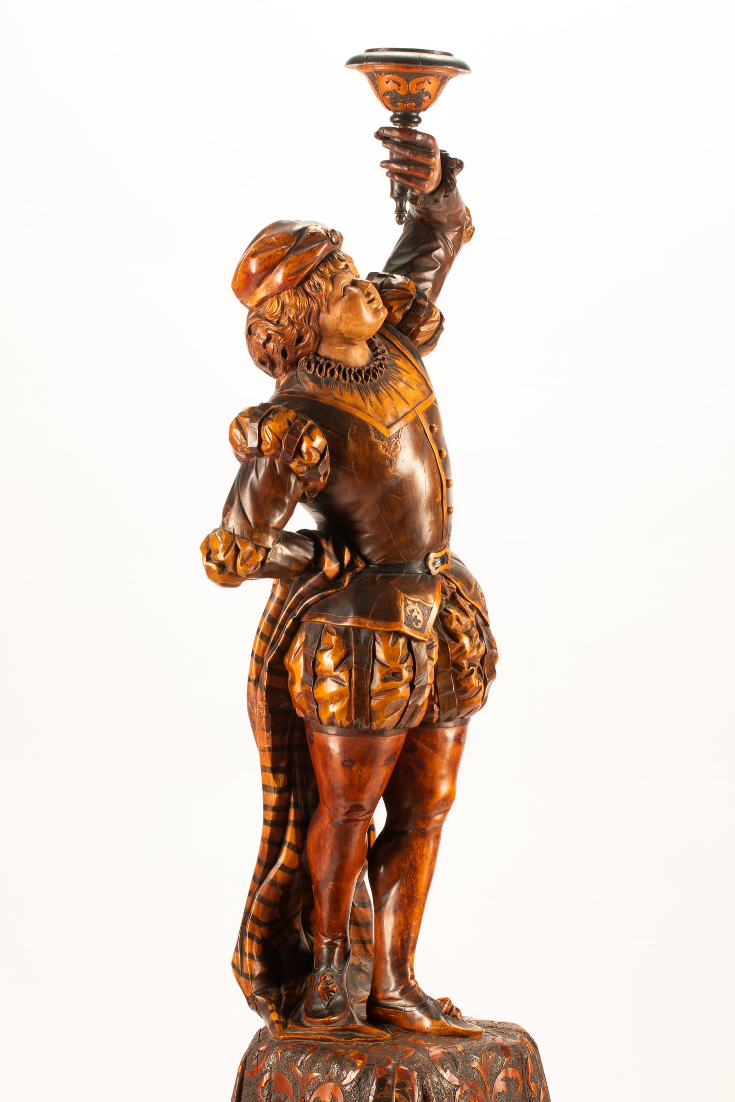 An Austrian Carved Wood Figural Torchere