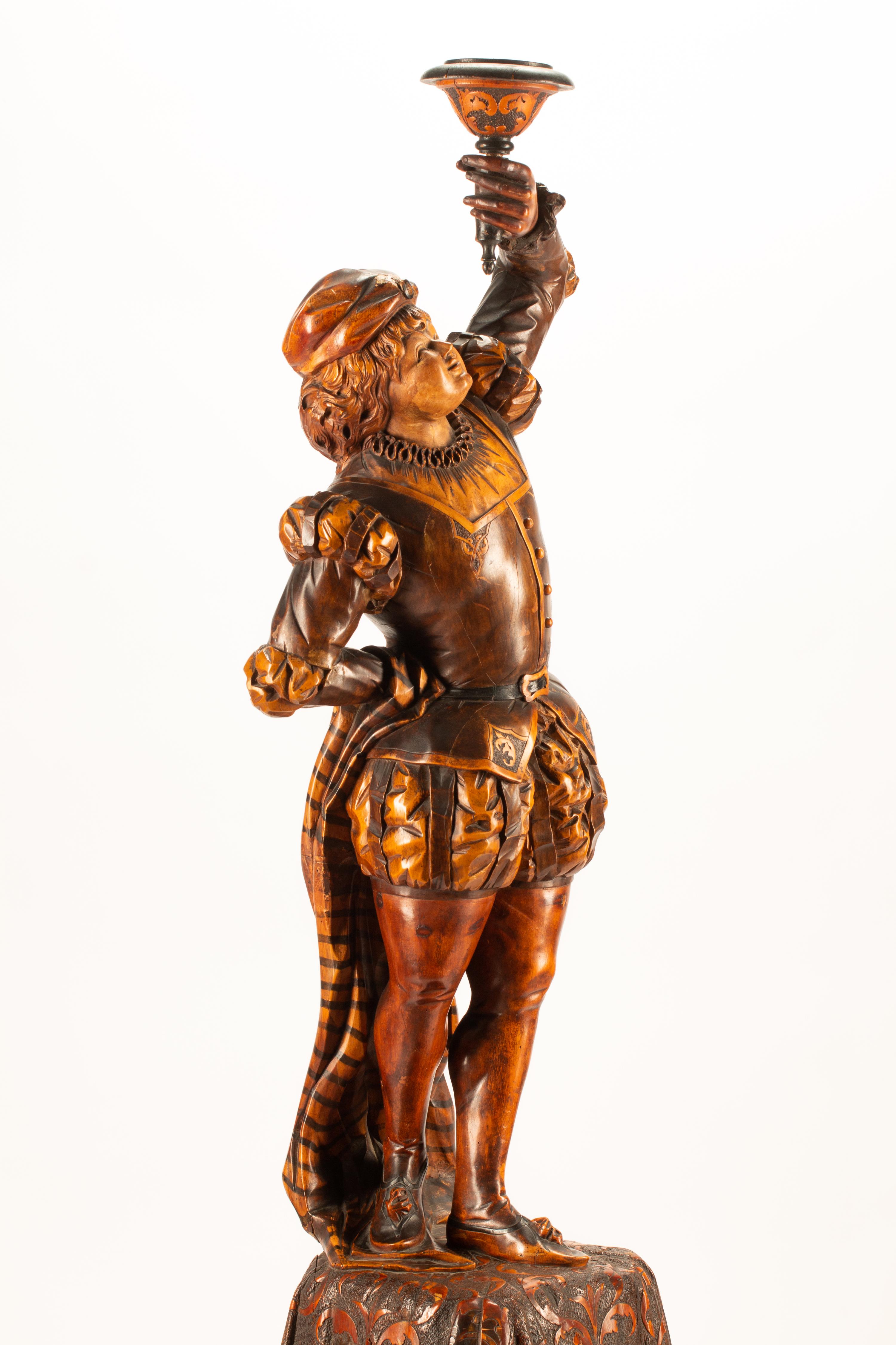 An Austrian Carved Wood Figural Torchere