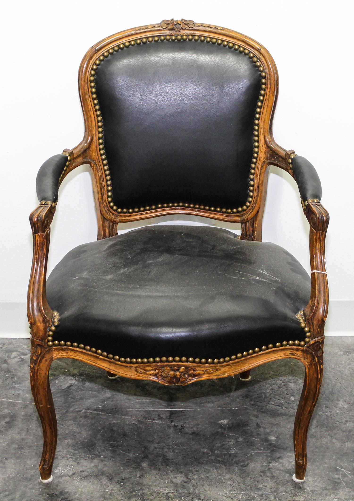 A Louis XV Style Walnut Fauteuil Height 33 inches.