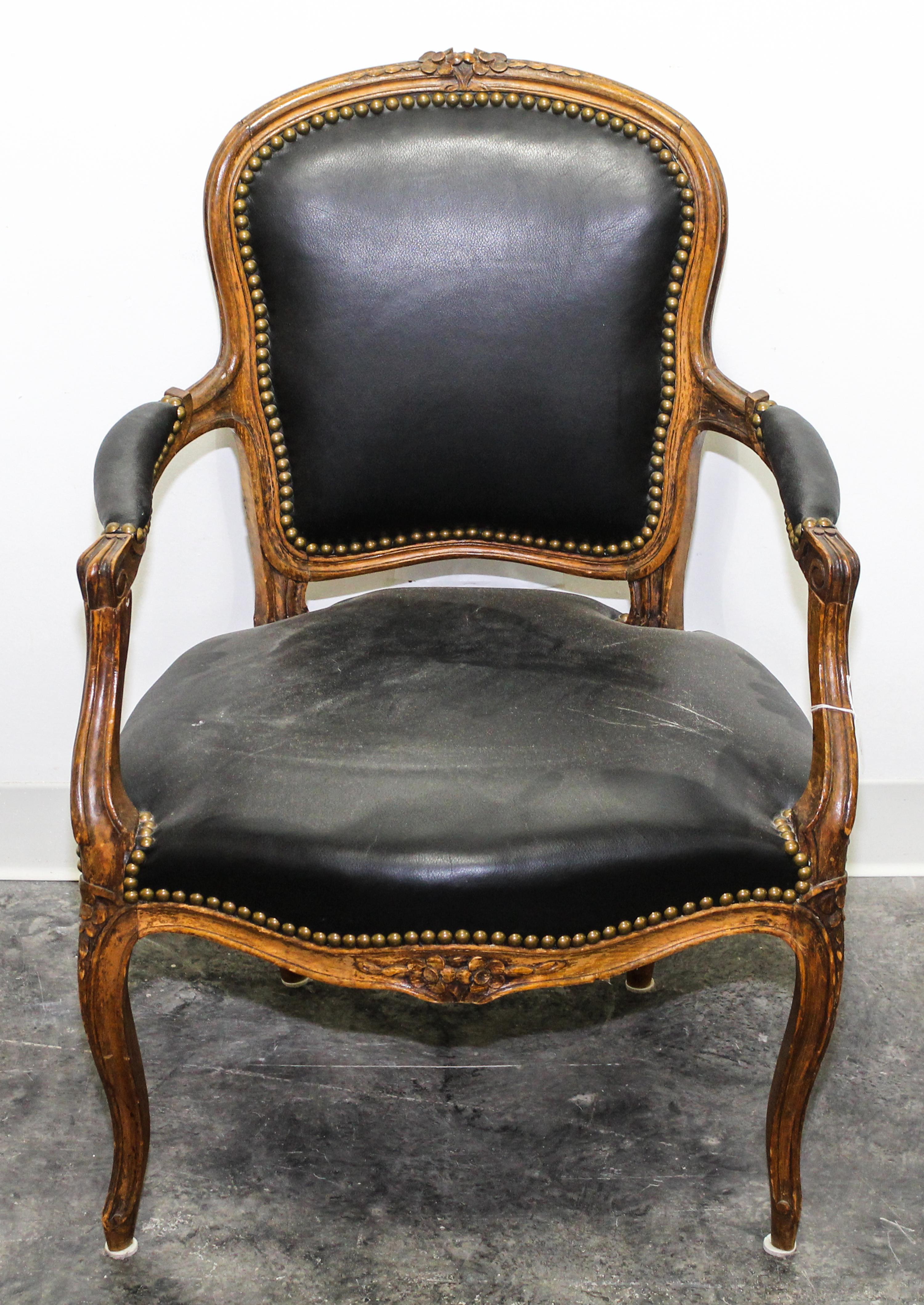 A Louis XV Style Walnut Fauteuil Height 33 inches.