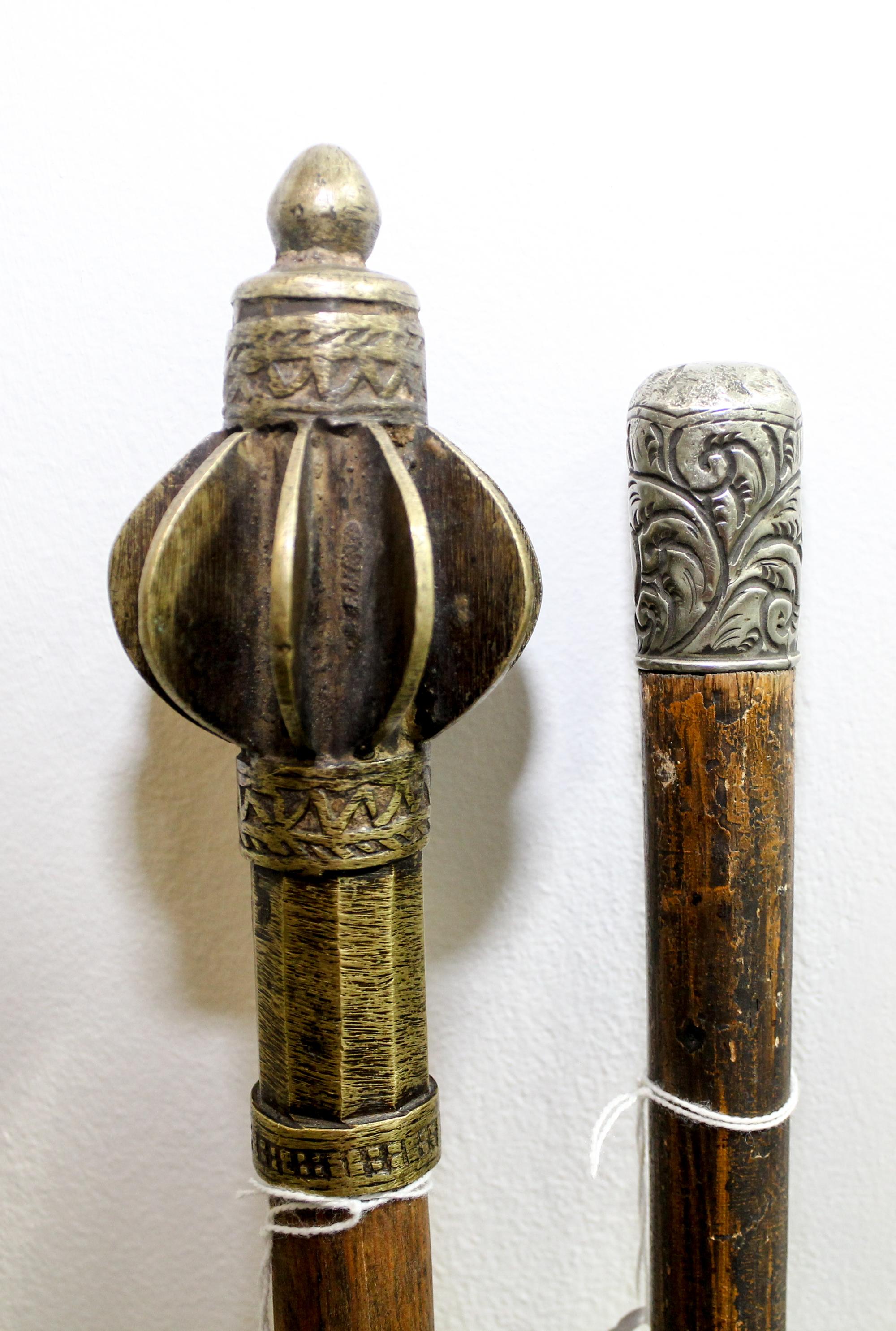 A Group of Two Canes Length of longest 35 1/4 inches.