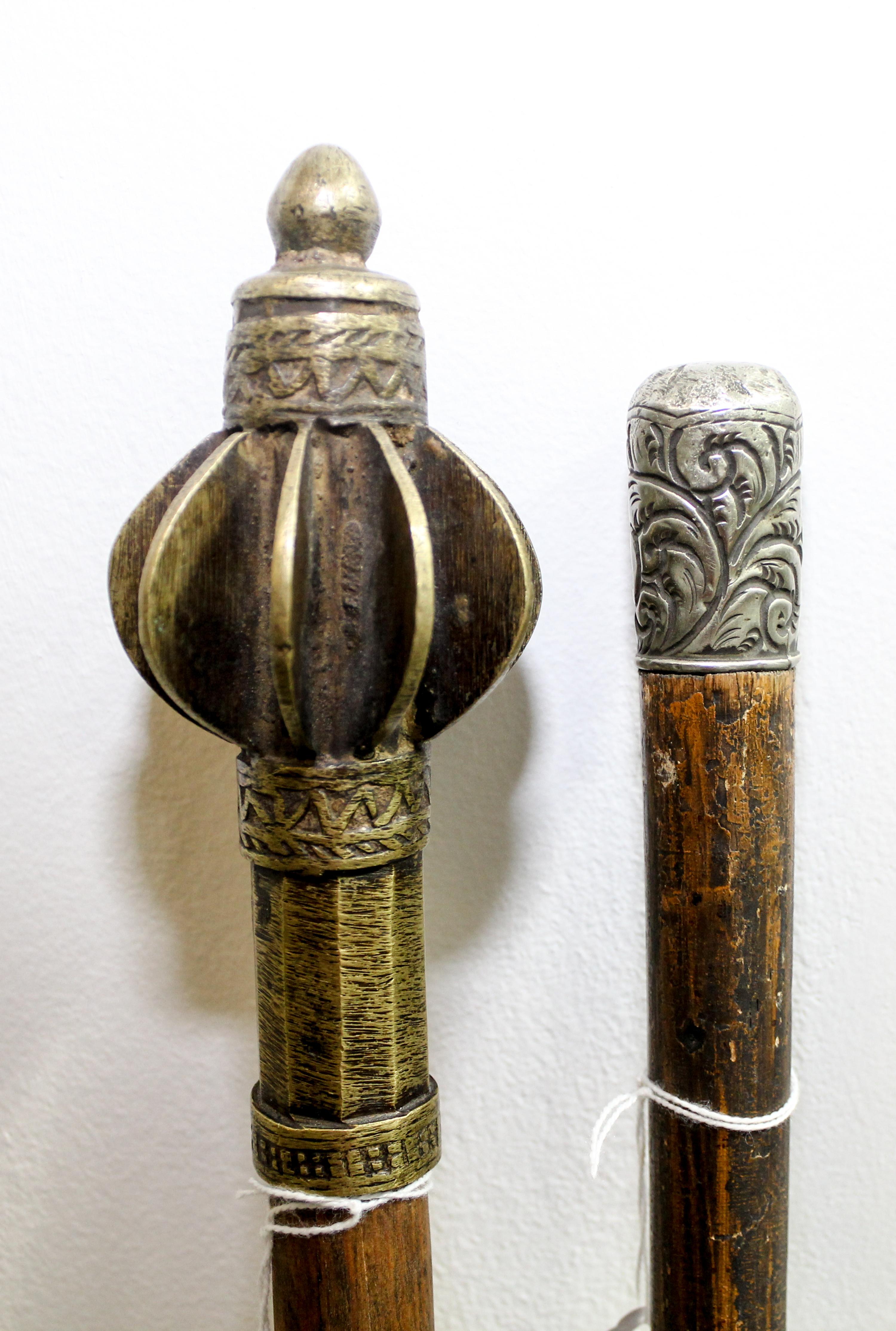 A Group of Two Canes Length of longest 35 1/4 inches.
