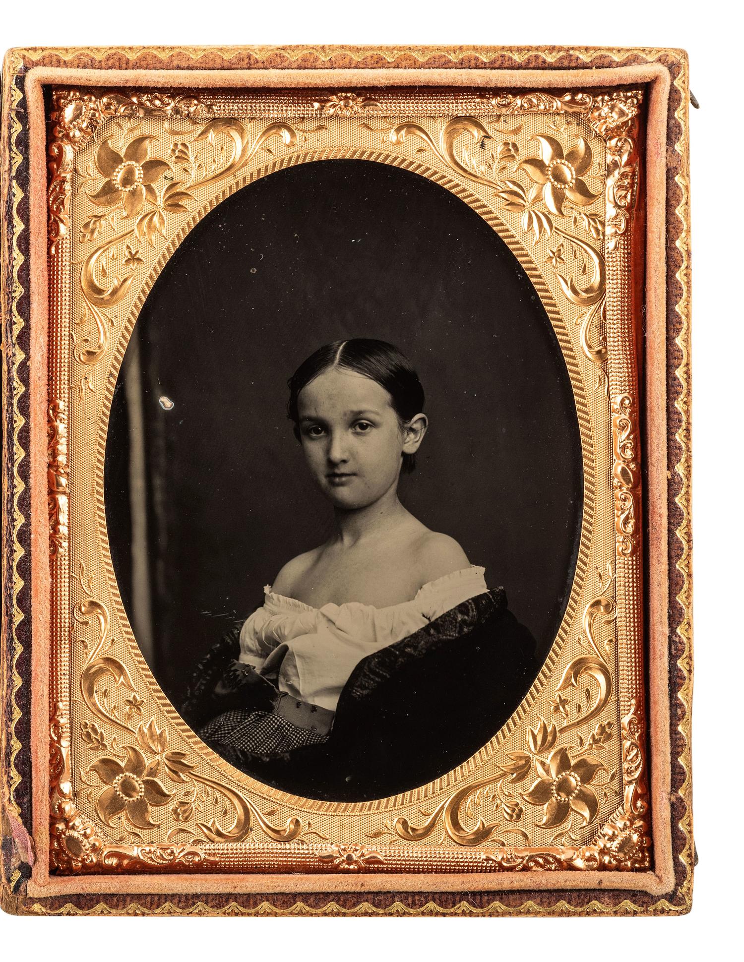 [EARLY PHOTOGRAPHY]. Quarter plate ambrotype of a young girl wearing an off-the-shoulder blouse.