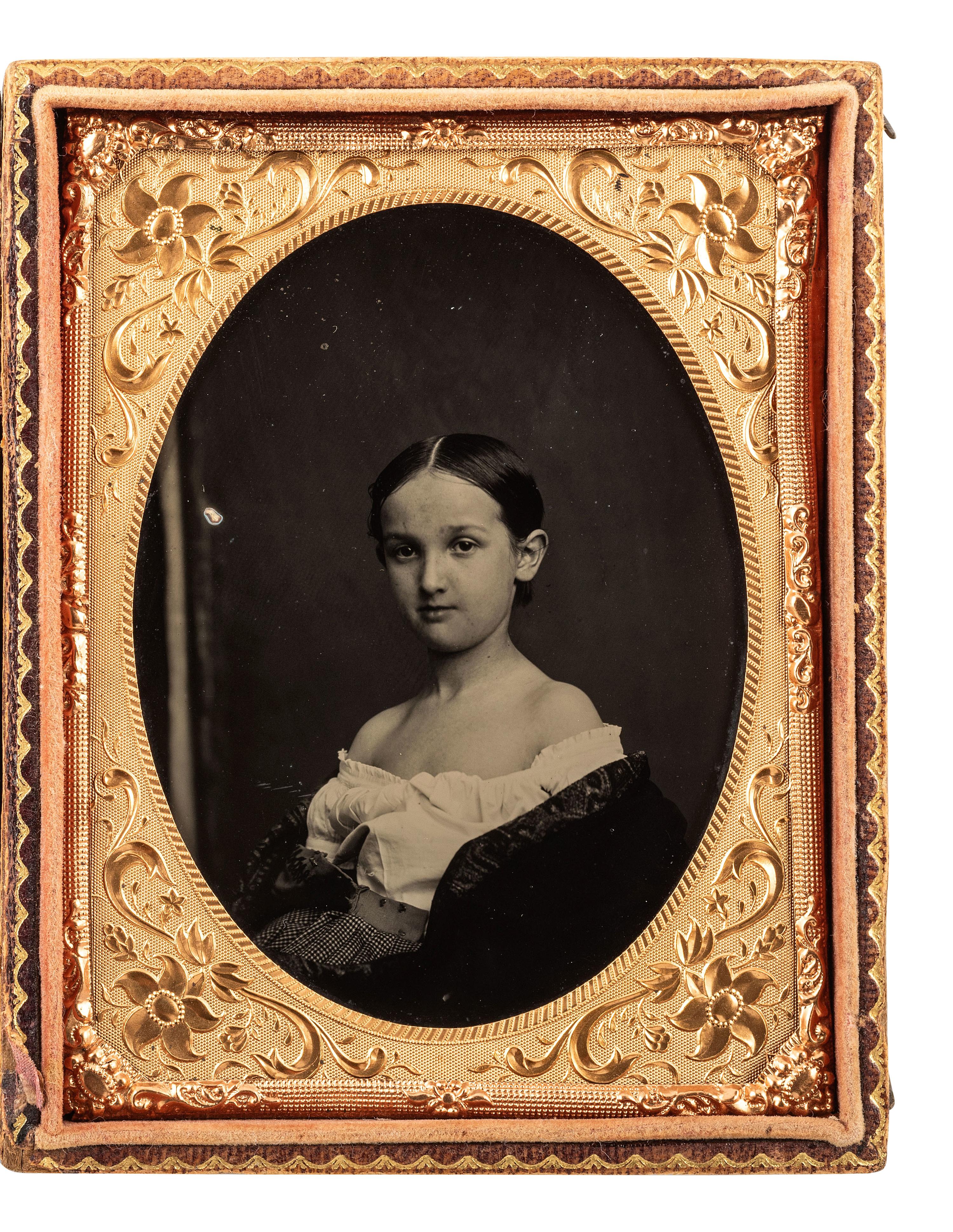 [EARLY PHOTOGRAPHY]. Quarter plate ambrotype of a young girl wearing an off-the-shoulder blouse.