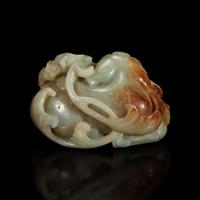 A Chinese greyish-celadon and russet jade recumbent beast and lotus group 青玉雕瑞兽衔荷花 18th century or earlier ???????