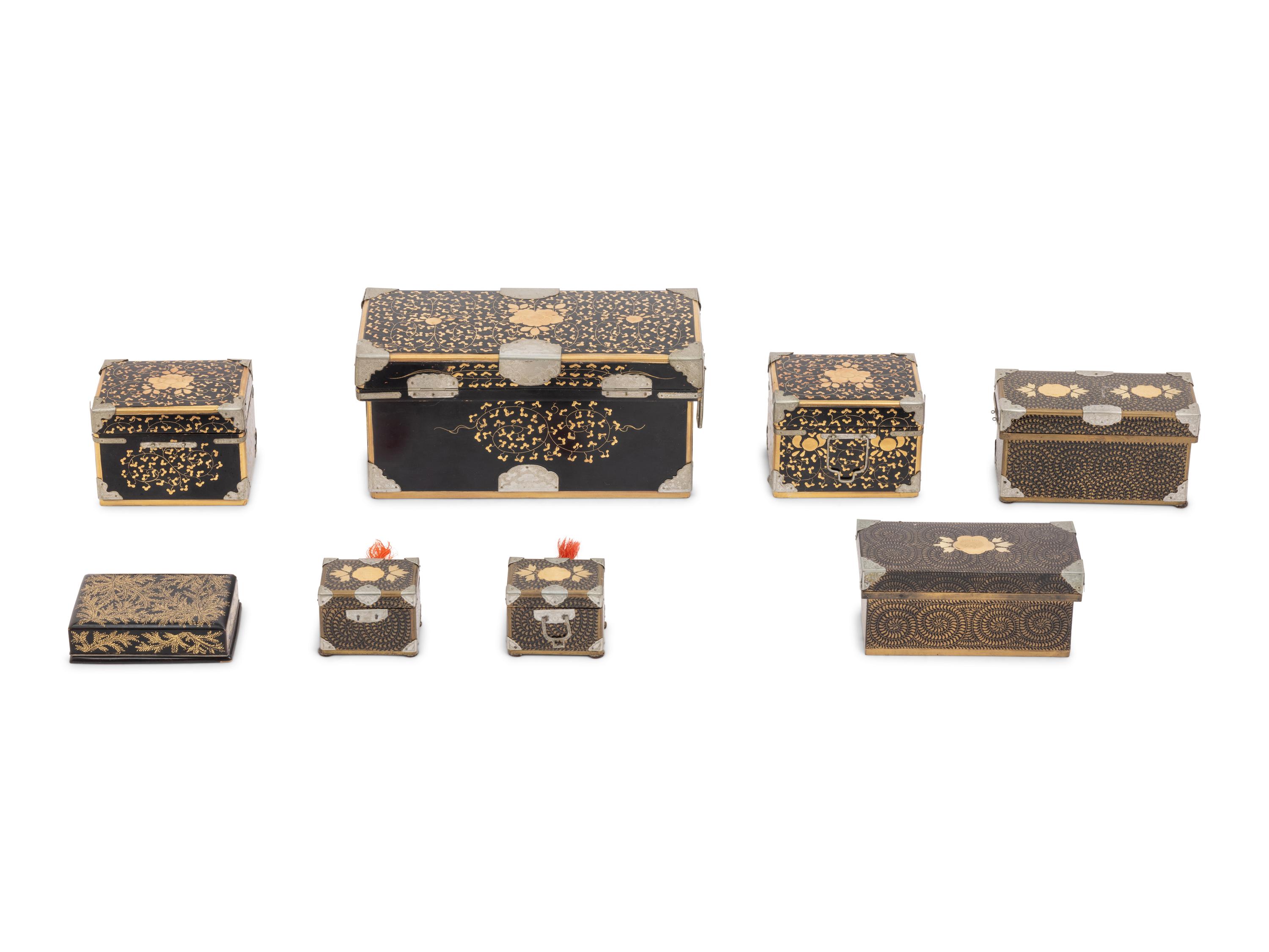 Eight Japanese Gilt and Black Lacquered Boxes