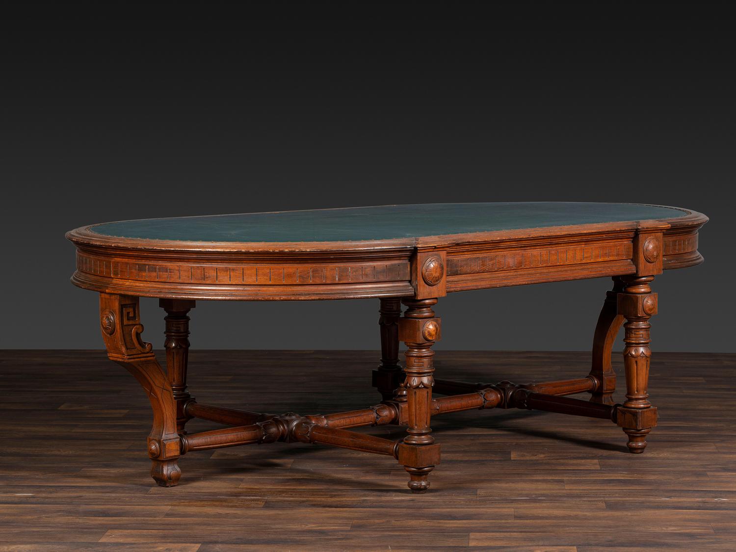 An Aesthetic Movement Leather Inset Carved Walnut Board Table
