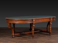 An Aesthetic Movement Leather Inset Carved Walnut Board Table