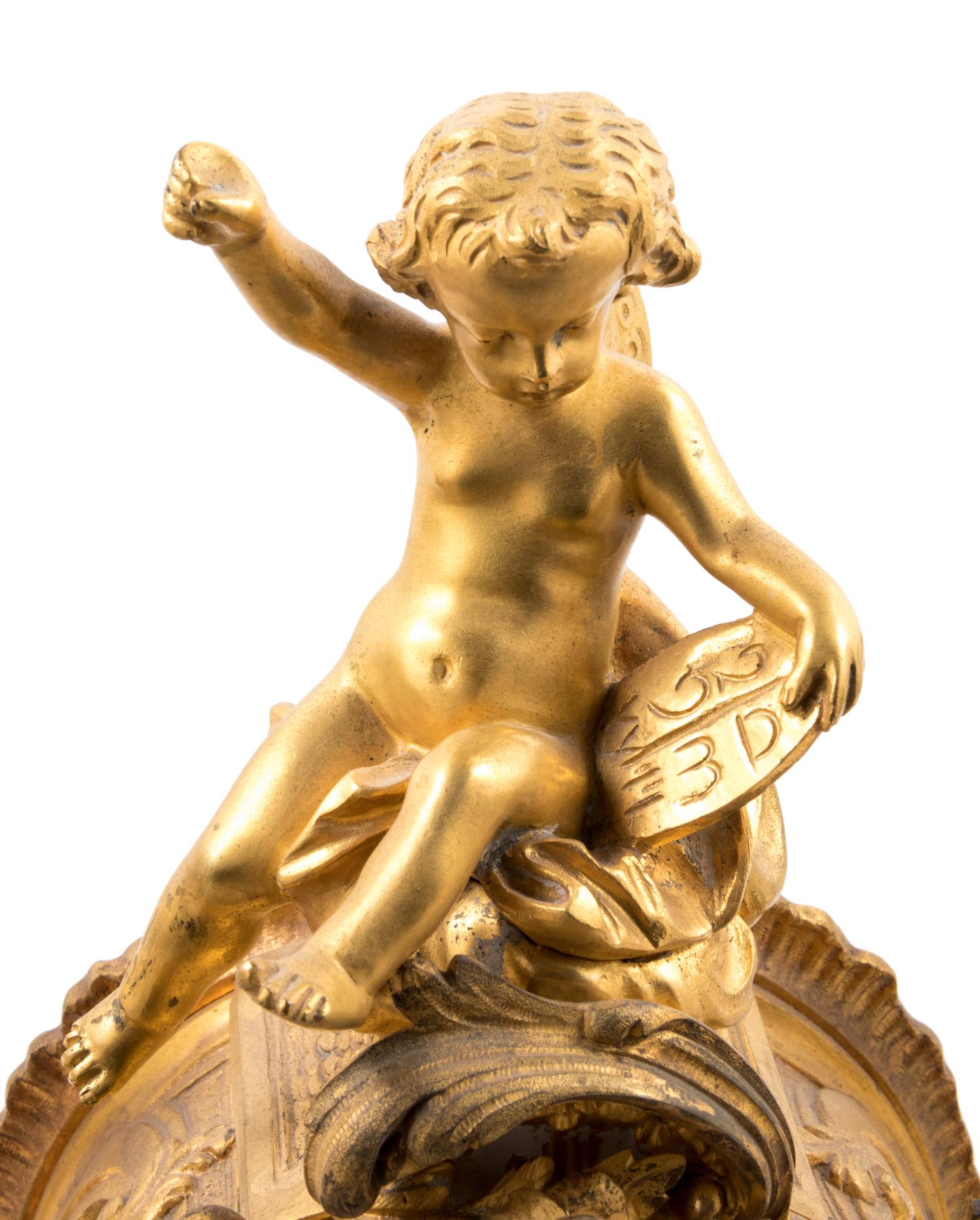 A Louis XV Style Gilt Bronze and Champlevé Enamel Clock Garniture